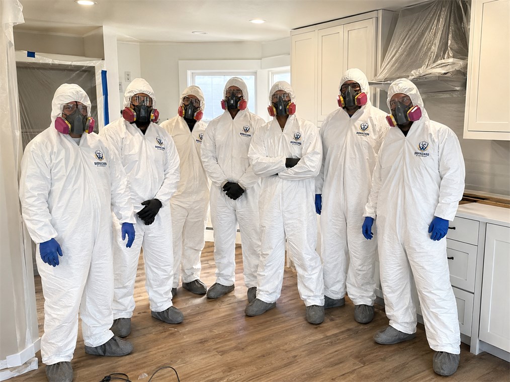 Professional cleanup team wearing PPE and uniforms
